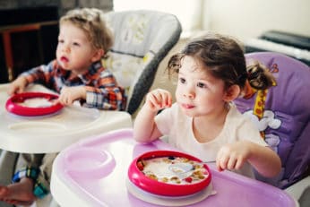 two children eating their meal