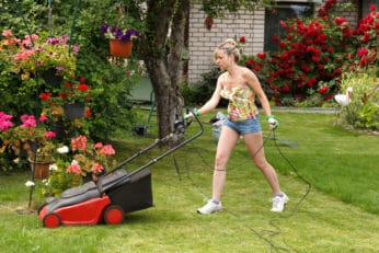woman cutting grass