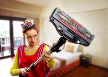 housewife using a hoover