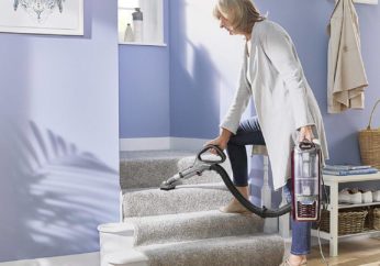 vacuuming stairs with a handheld