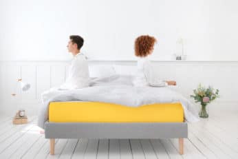 couple sitting on a bed