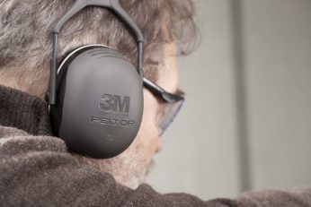 close up of a man with ear defenders