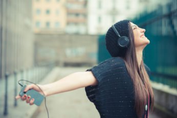a brunette enjoying music