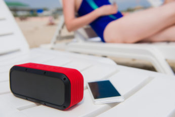 portable amplifier and phone on beach lounger