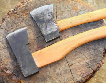 two blades on top of wood