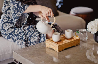 woman pouring tea